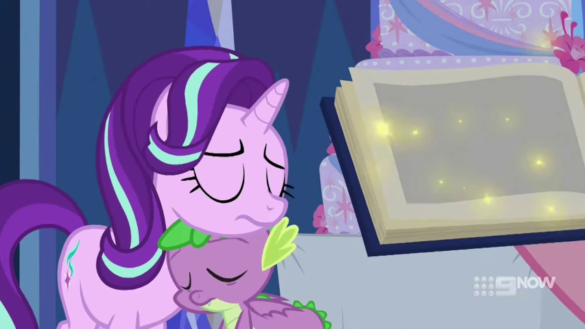 Glimmy and Spike sleeping on each other