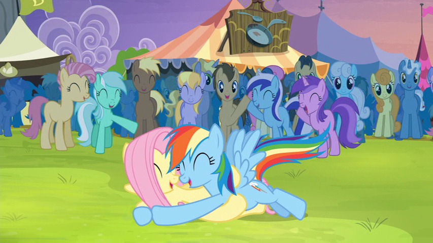 Rainbow Dash tackles and cuddles Fluttershy.